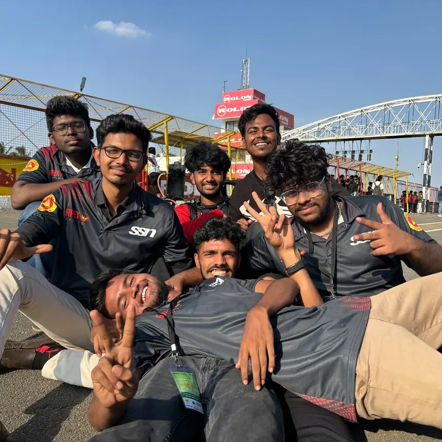 Team members piled together on the pit wall, laughing between runs.
