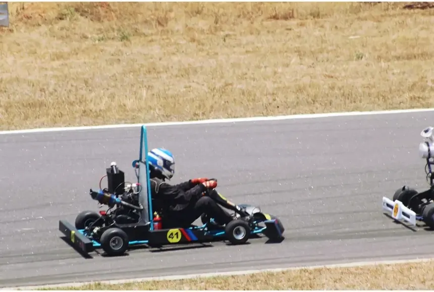 The kart on track at GKDC with the number board on its side pod.