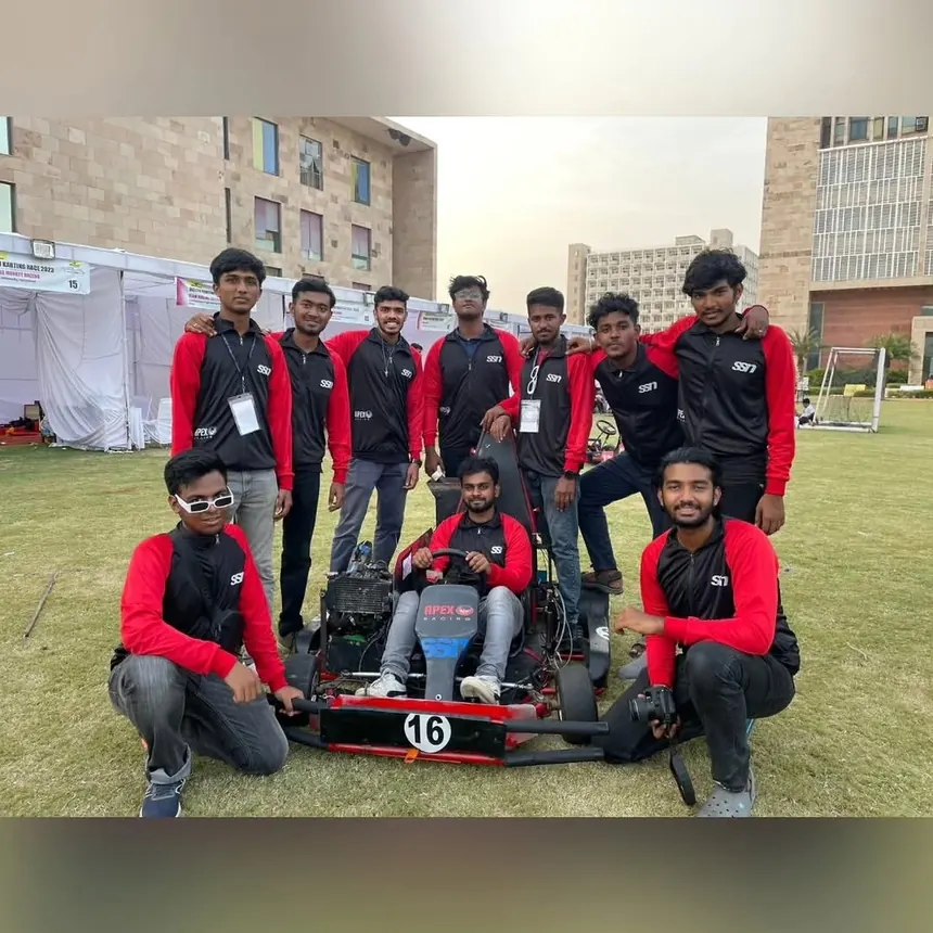 The IKR team photo with the kart, number 16, outside the college blocks.